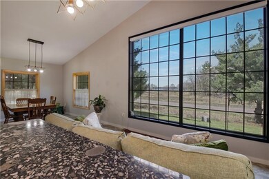 Massive west facing lakeside window overlooking North Sand Lake.