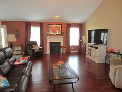 The Great Room has vaulted ceilings and hardwood f