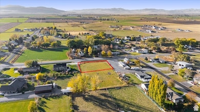View of property location with property boundaries highlighted, nearby suburban area, and rural landscape