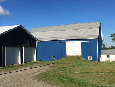 3 great out buildings with metal roofs