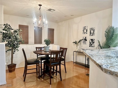Dining space featuring an inviting chandelier, lig