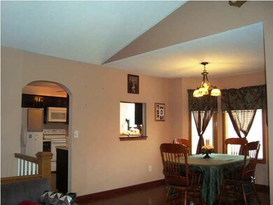 Formal dining with Tiffany Light Fixture and Pergo