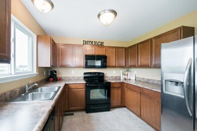 Plentiful cabinets and counter space in this well-designed U-shaped kitchen!