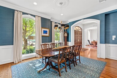 Formal dining with grass cloth wallpaper and wains