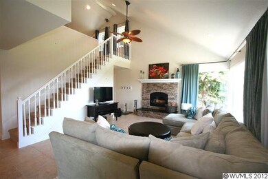 Stacked stone fireplace with granite hearth is a f