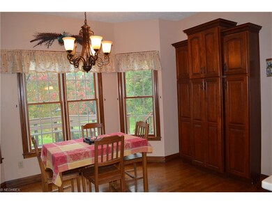Eating area of kitchen features additional cherry 