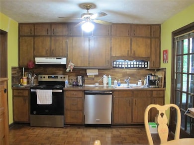 Kitchen with appliances with stainless steel finis
