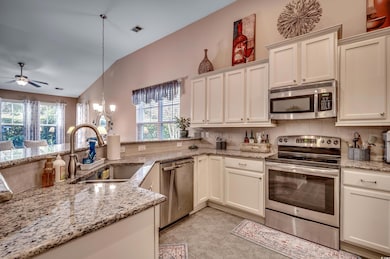 Kitchen with a wealth of natural light, pendant li
