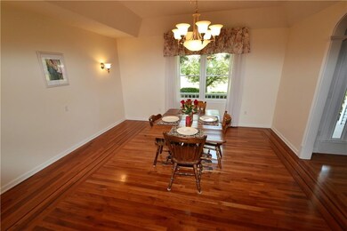 Formal dining room with cherry flooring