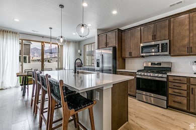 Extra large island, gas stove, and amazing views of mountains! Quartz counter tops and LVP throughout main living area are great upgrades!