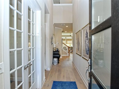 Foyer entrance featuring light wood finished floo