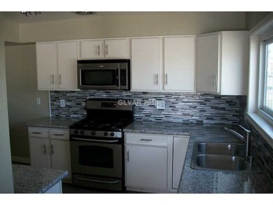 Property Photo. Stainless appliances and glass til