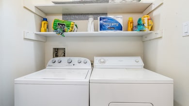 Indoor laundry room off of kitchen. Washer & Dryer
