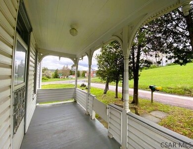 RELAX ON THE COVERED FRONT PORCH..