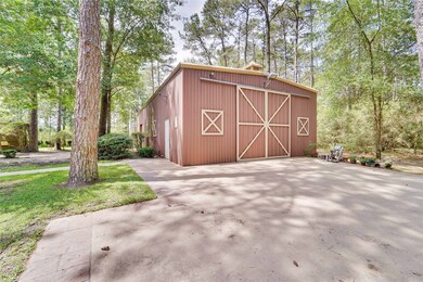 The 30x60 workshop/metal building has double doors for easy access to parking all toys including an RV and boat inside. Just open the doors and drive right in. The shop is climate controlled, has a full bath and a large office with storage above it. Inside is very spacious and has ample lighting.