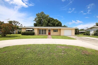 One car garage and a circular driveway