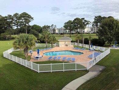 View of swimming pool featuring a patio and a lawn