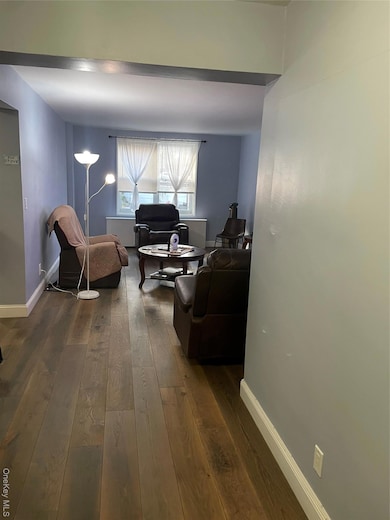 Office featuring baseboards and dark wood-type flooring