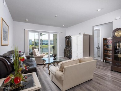 Living area with recessed lighting, visible vents,