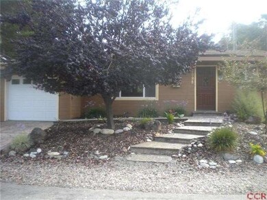 Front entry elevation. Attractive three-rivers roc
