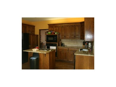 Hardwood floors, granite counters and neutral cera