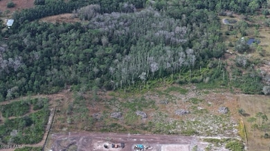 Mix of cleared land and woods.