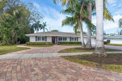 Front of home, paver circular drive and sidewalks.