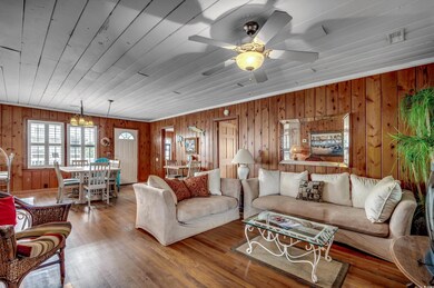 Living room with wooden ceiling, wood-type floorin