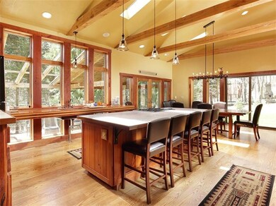 This grand kitchen and dining area are full of lig