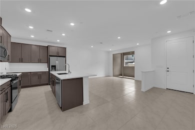 Kitchen featuring stainless steel appliances, a si