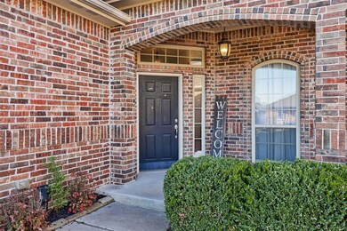 Entrance to property featuring brick siding