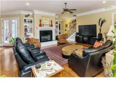 Family den has a fireplace and open to spacious ki