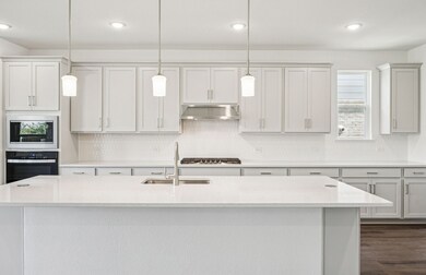 Spacious kitchen with eat-in bartop island