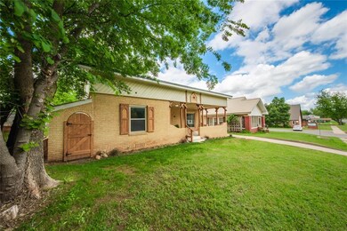 View of front of home featuring brick siding, a fr