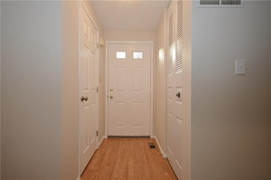 Reverse view of front entry.  Bathroom door on lef