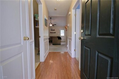 FOYER: The inviting foyer entry showcases hardwood