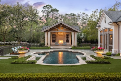 The pool pavilion offers a serene retreat, featuri