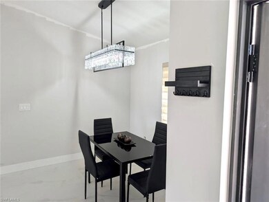 Dining area with marble finish floor and baseboard