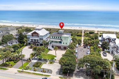 Aerial view of residential area featuring expansive coastline