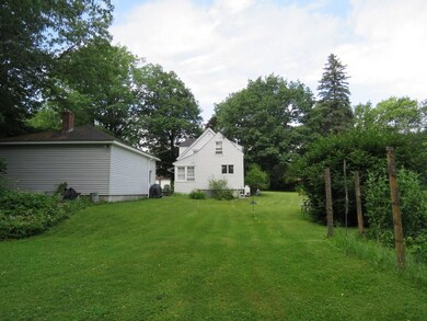 A huge back yard of manicured lawns.