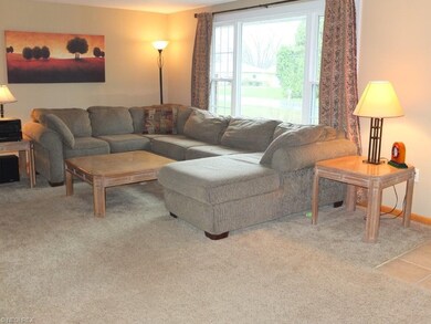 Spacious living room has picture window.