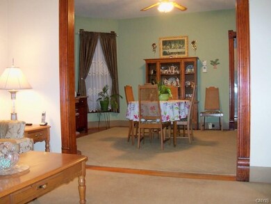 Living room flows into the spacious formal dining 