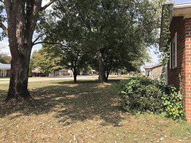Beautiful mature trees out front.