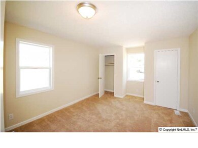 THE ISOLATED MASTER BEDROOM IS 13 X 12 WITH NEW CARPET AND FRESH PAINT.