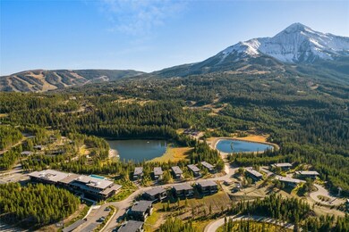 Drone / aerial view with a water and mountain view