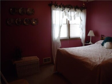 Bedroom. One of two bedrooms on second floor with 