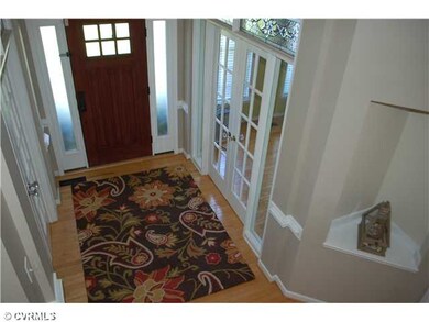 Foyer - Two-story hardwood foyer filled with light