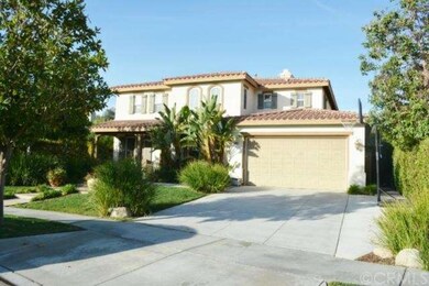 Front of home with three car tandem garage