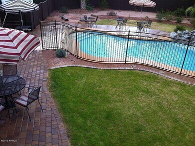 Huge back yard with pool, patio & grass