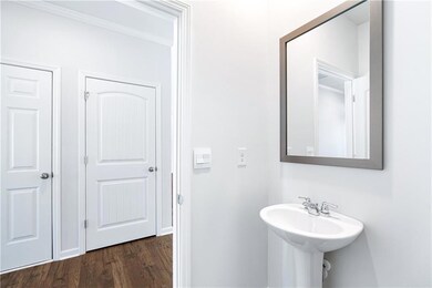 Bathroom with wood finished floors and a sink